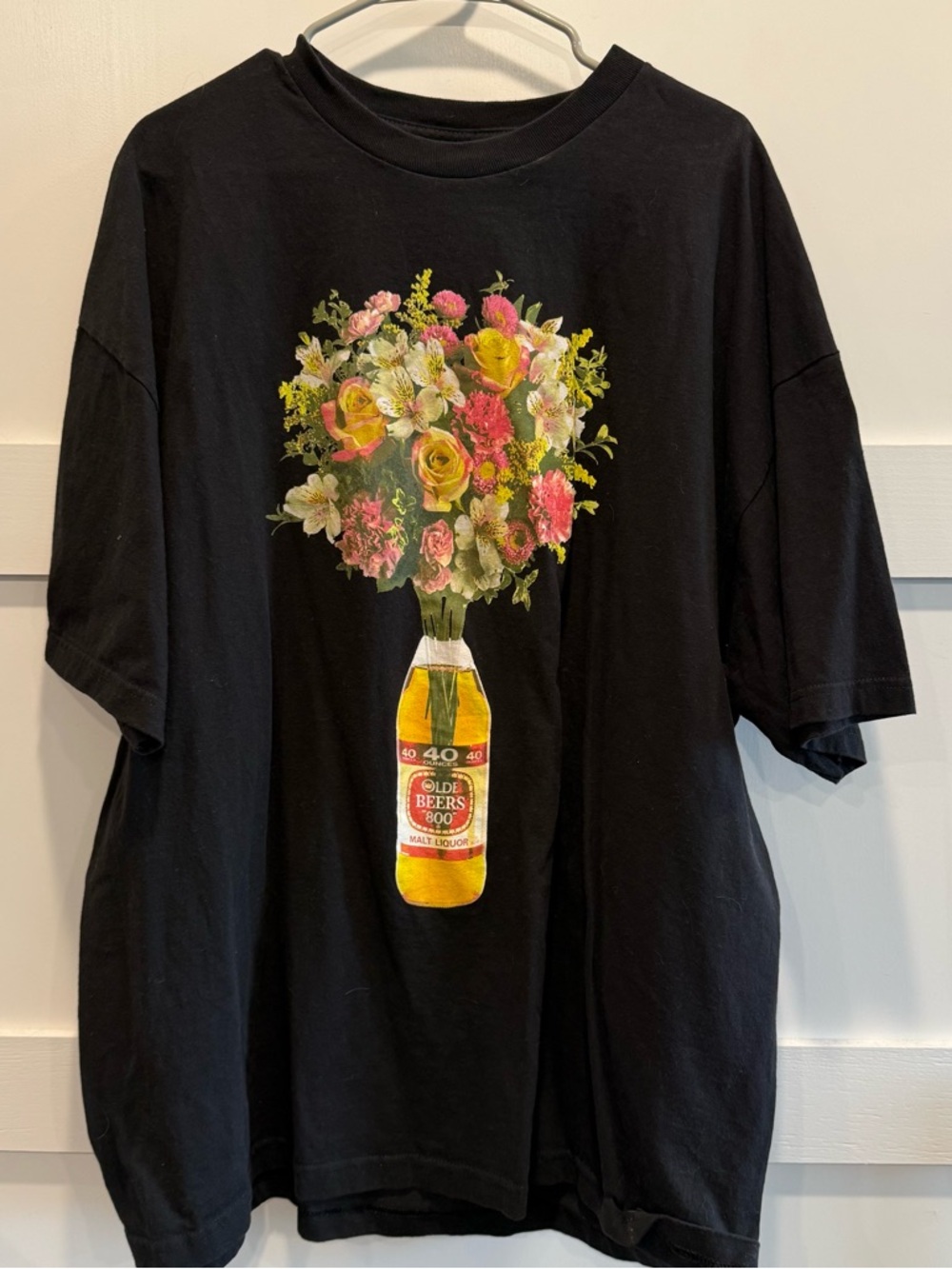 Black Short Sleeve Tee with Floral Bottle Graphic